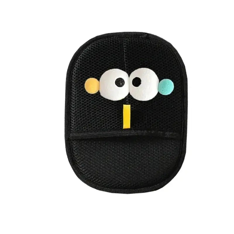 Black car seat cushion with cartoon face design on a white background