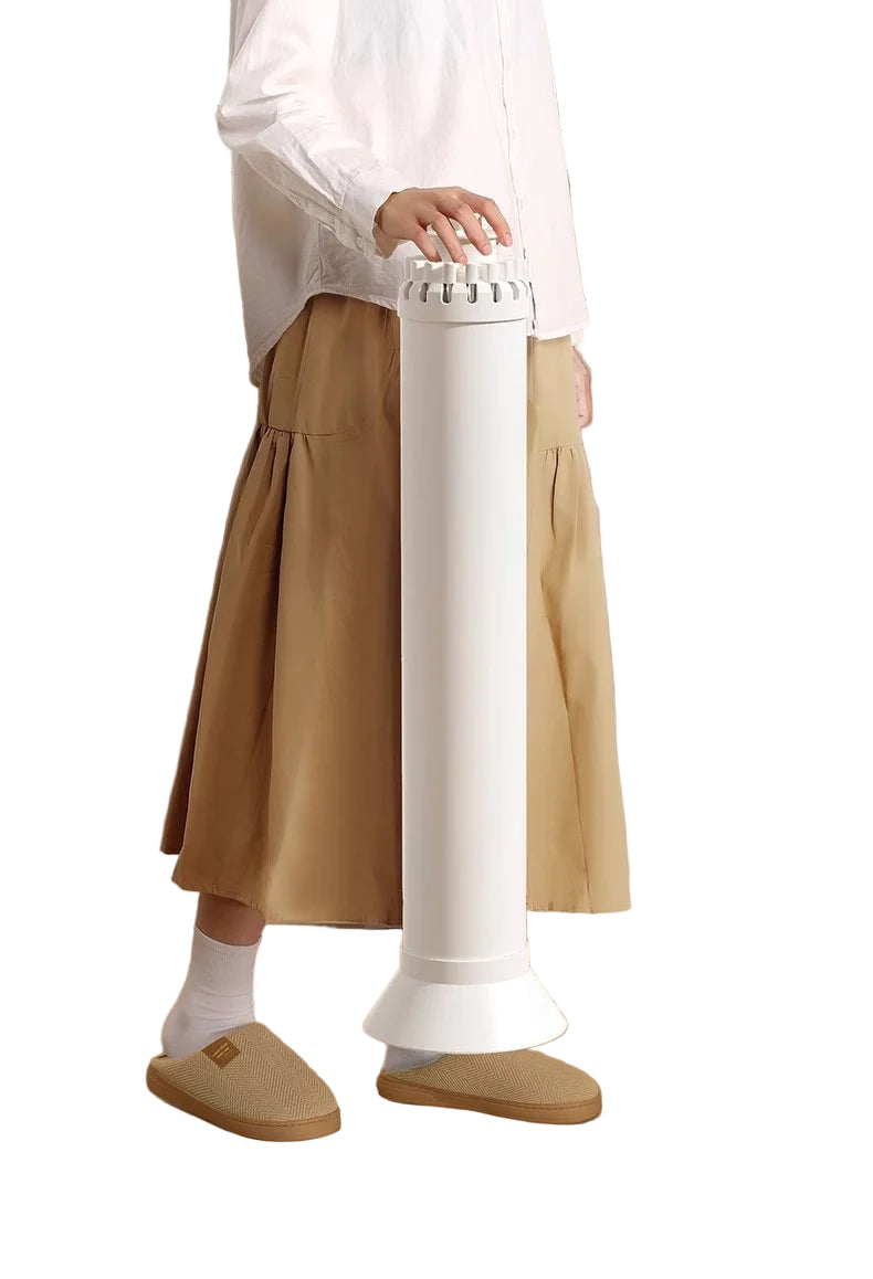 Person using a white foot-shaped device in a laundry room.