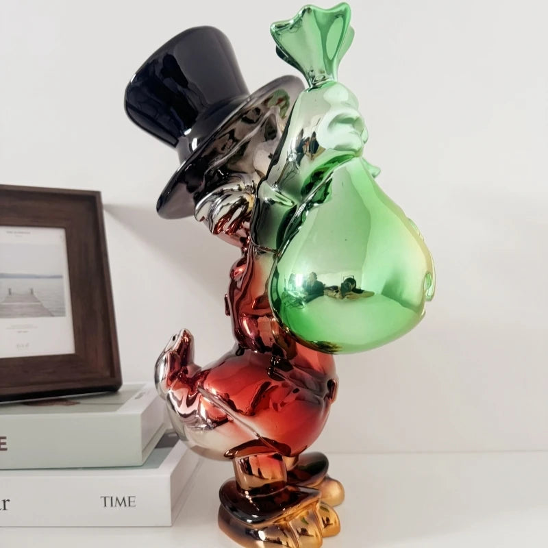 Decorative object with a green bag and black top hat on a white surface