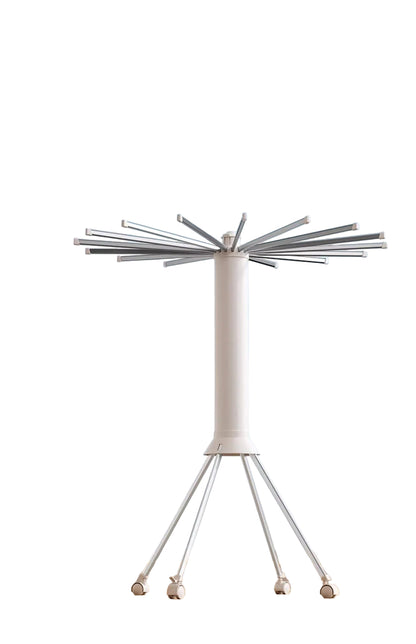 White outdoor umbrella with deployment mechanism against a blue sky background