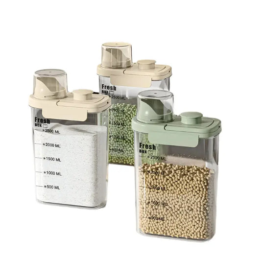 Three kitchen storage containers with measurement markings on a countertop.